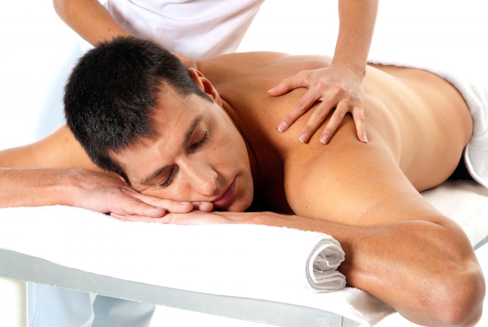 A man getting a massage at a spa.