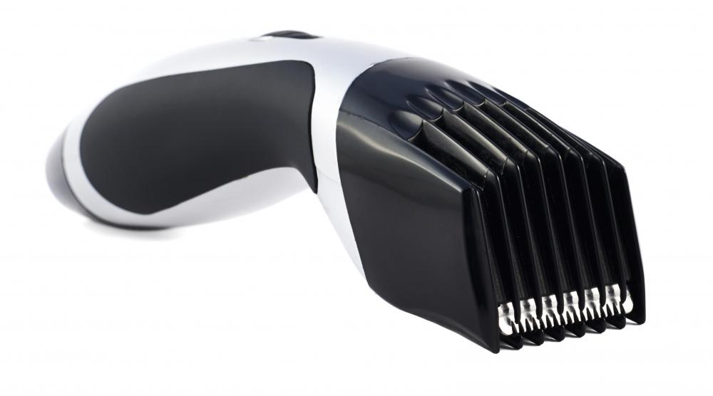 Electronic clippers are used to cut a tape up hairstyle.
