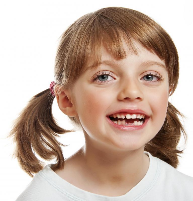 Girl with missing teeth.