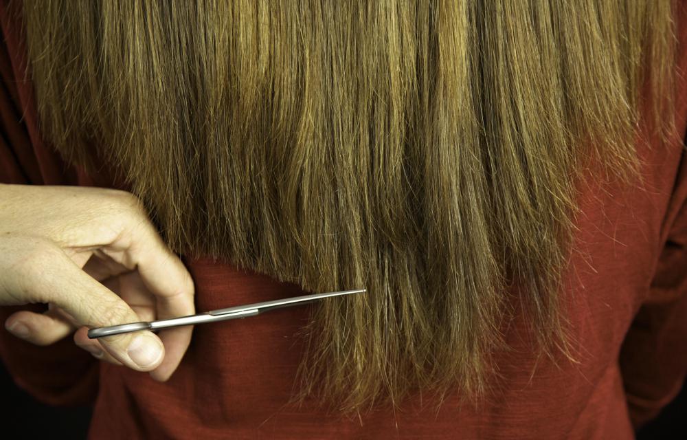 Getting regular trims may help prevent dry, frizzy hair.