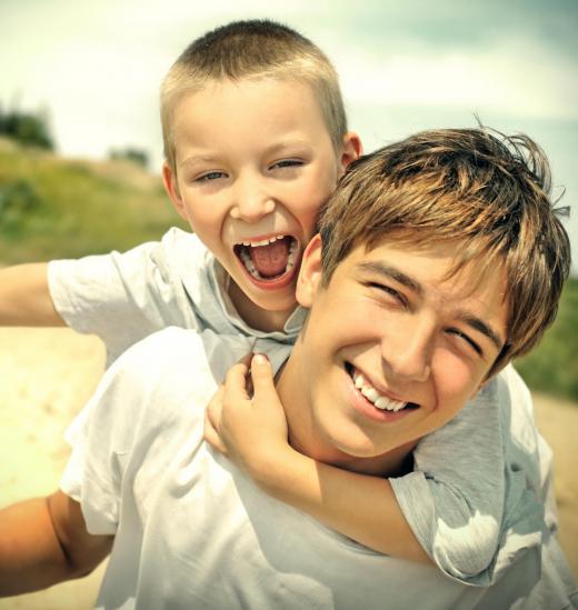 A comb-down haircut simply falls down the boy’s forehead and over his ears.