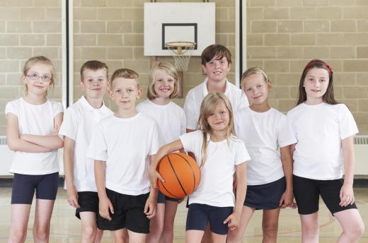 Some physical education classes require young male participants to wear proper protective gear.