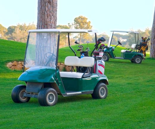 Golf umbrellas are bigger than regular umbrellas to protect both golfer and golf cart.