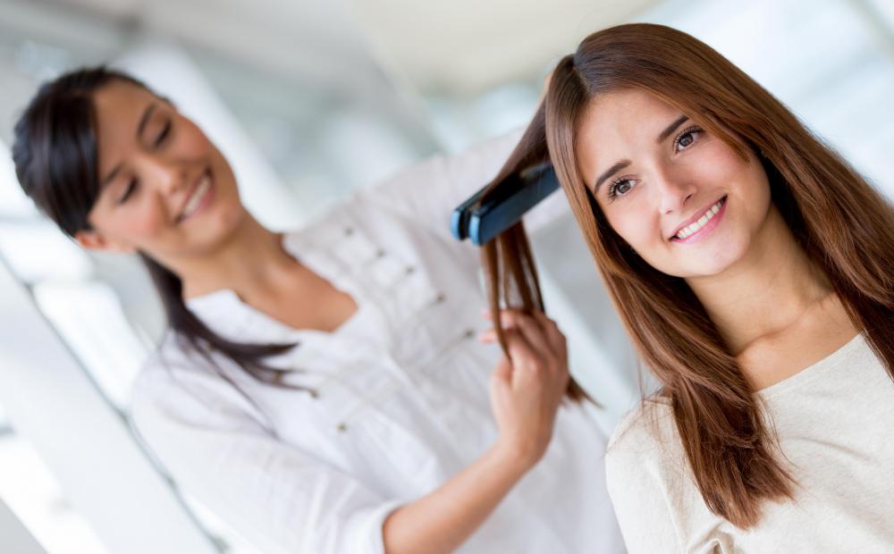 Flat ironing can help to reduce dry, frizzy hair.
