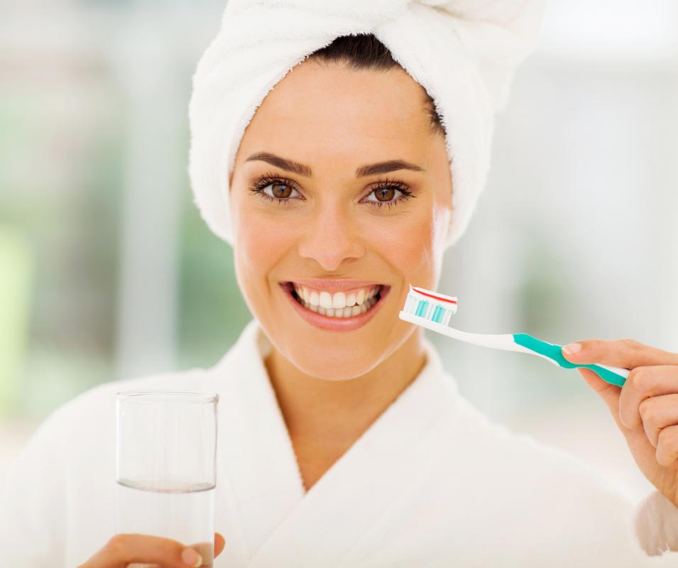 Regularly brushing the teeth with a regular toothbrush is necessary to reduce plaque buildup.