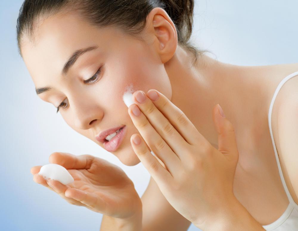 Moisturizing cream is applied to prevent dryness following a microdermabrasion procedure.