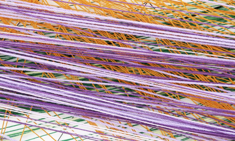 Making yarn dreadlocks requires at least one ball of thick wool yarn.