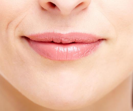 Lip balm can be applied to the lips with a squeeze tube.