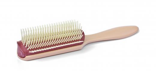 A regular hair brush can be used to brush a beard.