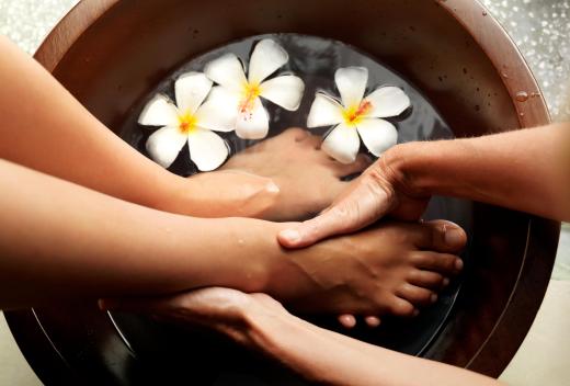 A woman getting a pedicure at a salon.