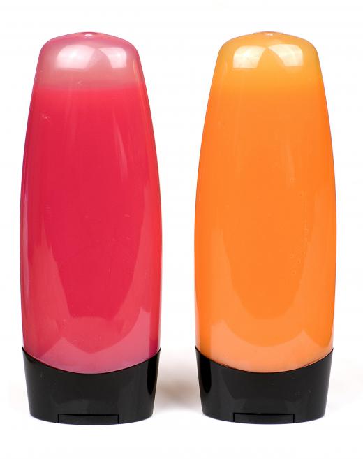 Bottles of pink and orange shower gel.