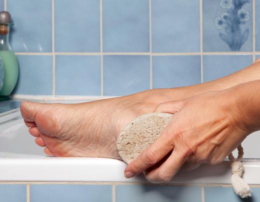 Some people like to use a pumice stone on their feet before applying paraffin.