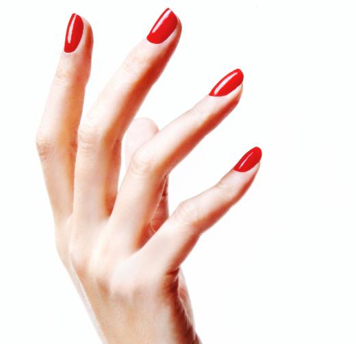 A woman with her nails painted with vegan nail polish.