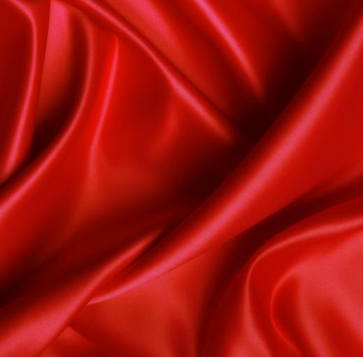 A closeup of red duchesse satin.