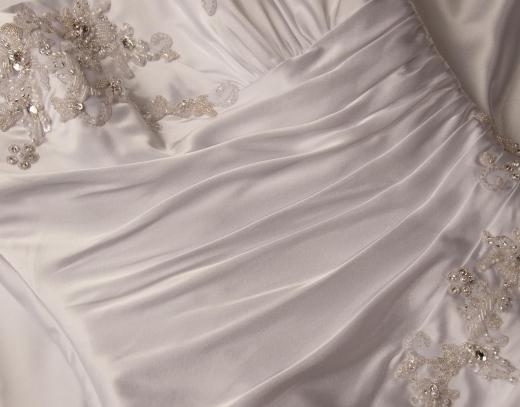 The bride chooses every type of material that will be used in a bespoke wedding dress.