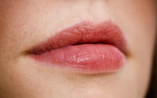 Lip gloss may provide a tint to the lips.