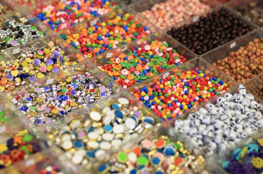 Plastic and glass beads are used to create beautiful bead necklaces.