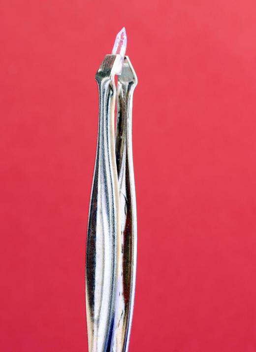 Scissor tweezers may be used for hair removal.