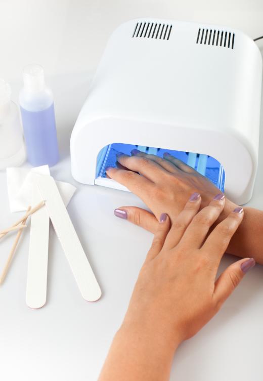 A person getting a bridal manicure.