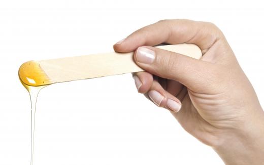 Sugar waxing is applied with a stick.