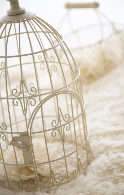 An ornamental birdcage fits the shabby chic style.