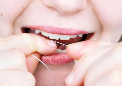 Brushing and flossing teeth ensures good daily oral hygiene.