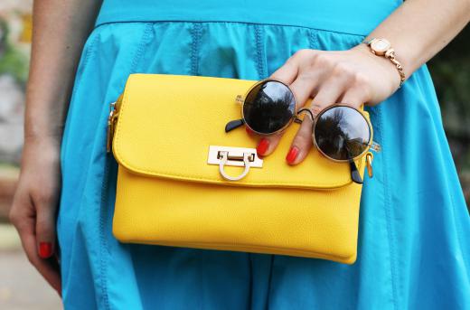 A squarish clutch purse is likely to be flattering for a woman who is tall and thin.