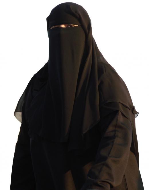 A woman wearing an abaya and a niqab.