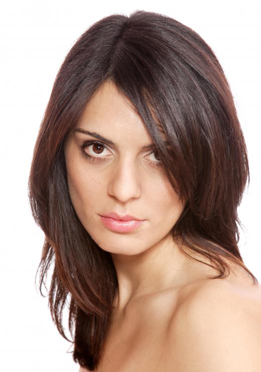 Changing the way the hair parts and growing bangs can help improve a bad hairline.