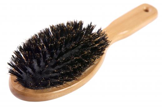 Boar bristle brushes effectively smooth, lift, and help redistribute oil throughout the hair.